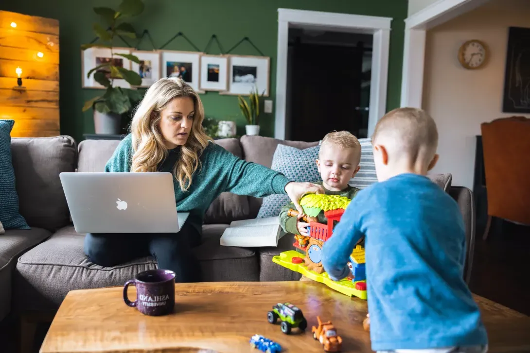 young mom working on computer